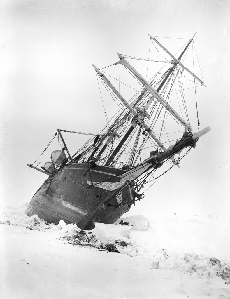 A sailing ship keeled over in the ice