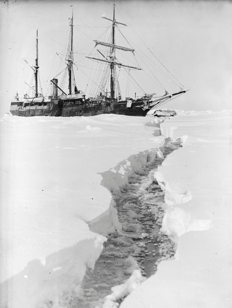 A long crack in the ice leads our eyes to a ship stuck