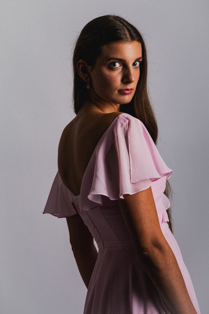 portrait of a woman in a light pink dress