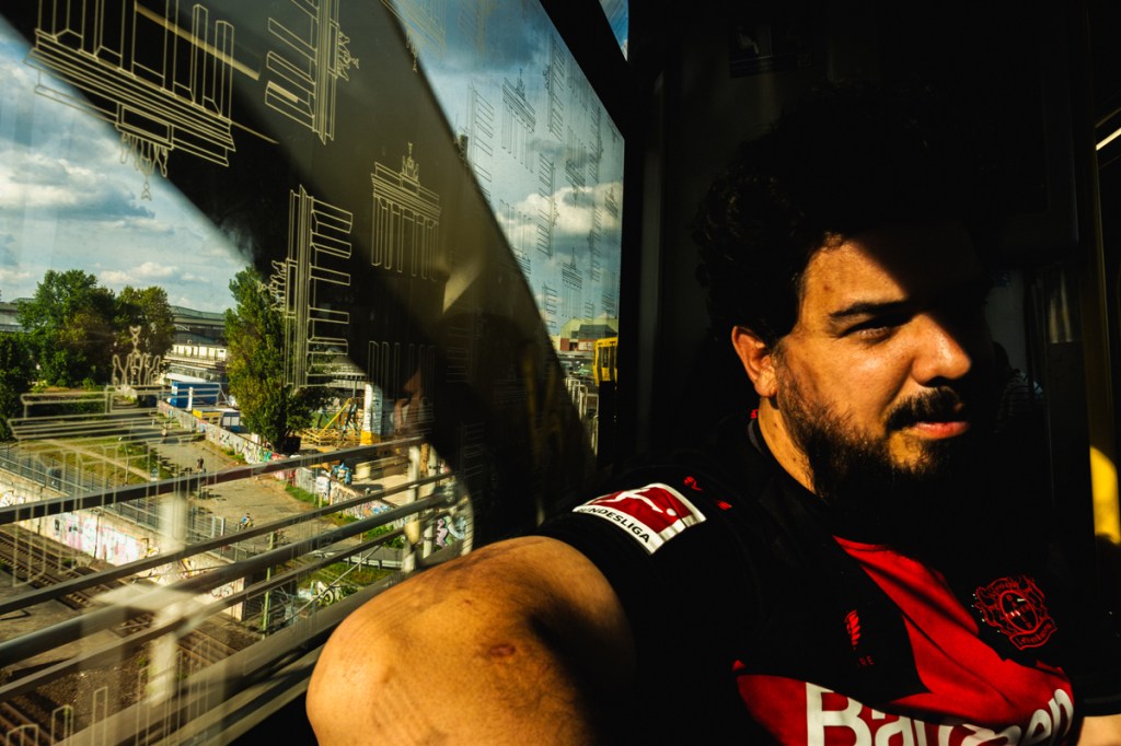 photo of a person in the window of a train