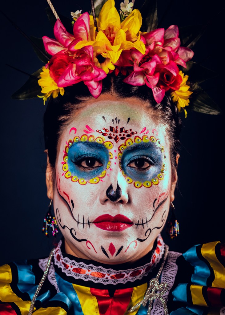 portrait of a woman with mexican day of the dead facepaint