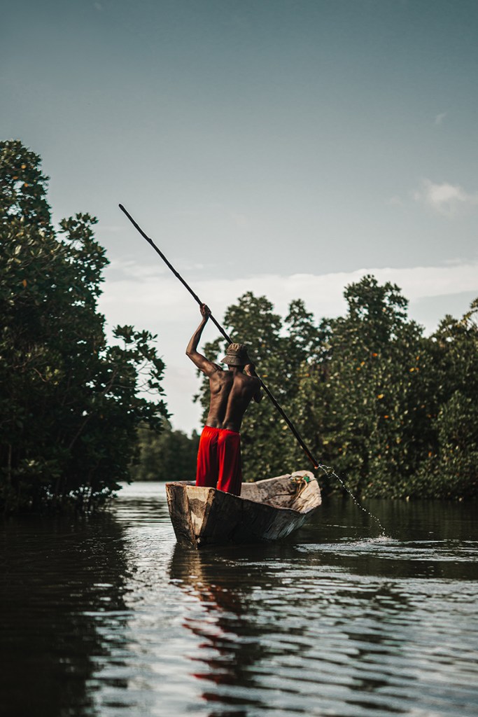 A man paddles through Chwaka mangroves on a traditional boat Sony A7IV, Sigma 56mm f1.4, f1.6 at 1/1000