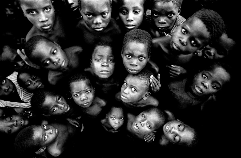 Orphans of the civil war, MOZAMBIQUE 1990. “In a moment that will stay with me forever I learned that many of these children watched their parents being killed, some were even forced to participate.” Image Credit © Simon Townsley