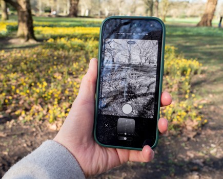 An iPhone 17 Pro in hand, showing a special mode on screen