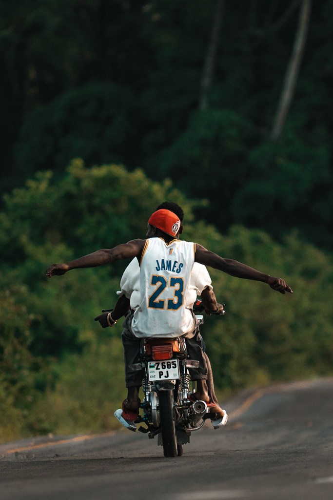 Two men riding a motorcycle in Central Zanzibar Sony A7IV, Sigma 150-600mm DG DN Sports, f6.3 at 1/1250