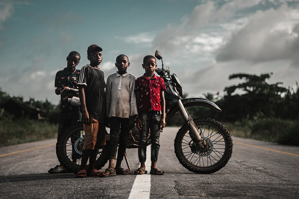 My favourite photo from the trip. Taken while travelling the island on the motorcycle pictured. The four boys showed an interest in the bike and my camera. Despite laughing and joking between themselves, they all looked very serious for a brief moment at the point of clicking the shutter. Sony A7IV, Sigma 56mm f1.4 Lens, f1.6 at 1/1000